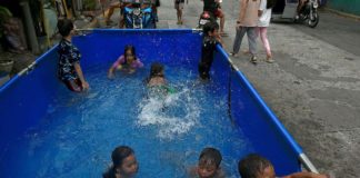 Children at a neighborhood at Blumentritt Road in Manila cool off at an inflatable pool. RICHARD A. REYES, PHILIPPINE DAILY INQUIRER