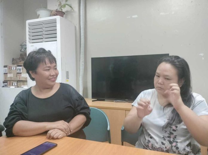 Joan Briones (left), Bacolod Integrated Deaf Association (BIDA) coordinator, and La Fonsa Marie Latosa (right), BIDA president