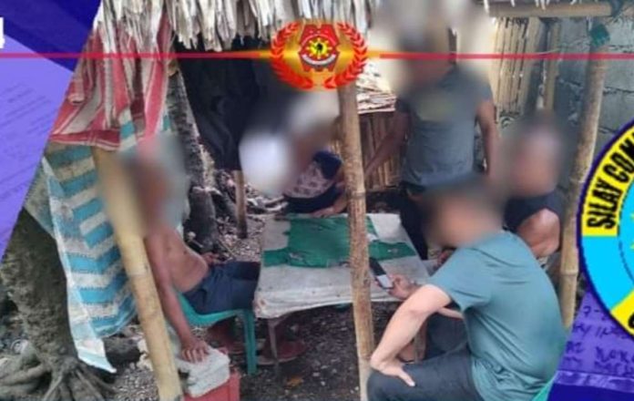 Three men were caught in the act playing tong-its in Barangay Guinhalaran, Silay City, Negros Occidental on May 14. They are facing charges for violation of Presidential Decree 1602, which penalizes engaging in illegal gambling activities, according to the Silay City police station. SILAY CITY PNP PHOTO