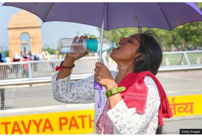 A visitor drinks water at India Gate during a hot weather on May 26, 2024 in New Delhi. India’s weather office has issued a severe heatwave alert for parts of Indian capital Delhi. GETTY IMAGES