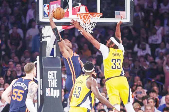 New York Knicks’ OG Anunoby (8) attempts to dunk past Indiana Pacers' Myles Turner (33). PHOTO BY WENDELL CRUZ-USA TODAY SPORTS