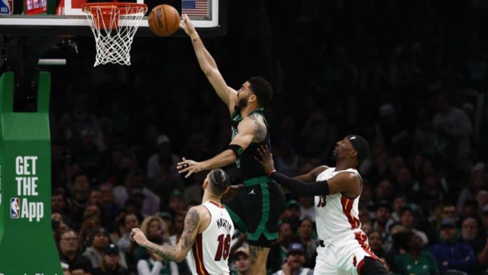 Boston Celtics forward Jason Tatum stretches for a layup. PHOTO COURTESY OF WINSLOW TOWNSON/USA TODAY