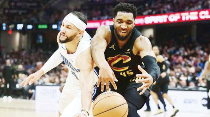 Cleveland Cavaliers’ Donovan Mitchell and Orlando Magic's Jalen Suggs battles for the looseball. PHOTO COURTESY OF USA TODAY SPORTS