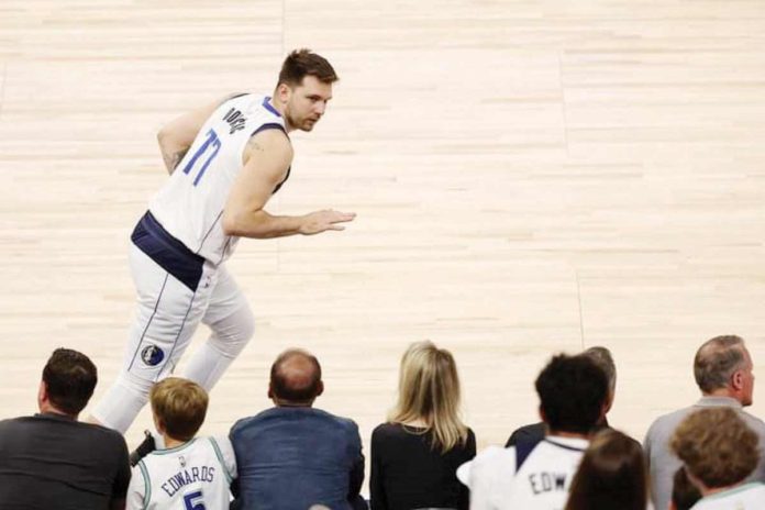 Dallas Mavericks’ Luka Doncic gestures to the crowd after scoring a three-pointer. PHOTO COURTESY OF MATT KRONH/AP