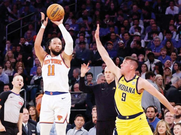 Jalen Brunson of the New York Knicks shoots over T.J. McConnell of the Indiana Pacers. PHOTO COURTESY OF SARAH STIER/GETTY IMAGES