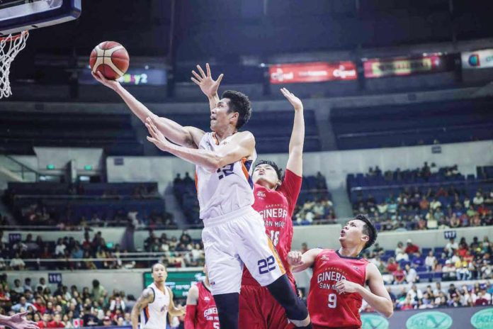 Meralco Bolts’ Allein Maliksi evades the defense of Barangay Ginebra San Miguel Kings’ Ralph Cu for a layup. PBA PHOTO