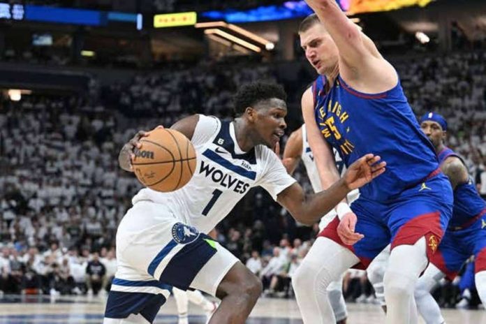 Minnesota Timberwolves’ Anthony Edwards tries to attack the defense of Denver Nuggets’ Nikola Jokić. PHOTO COURTESY OF USA TODAY SPORTS