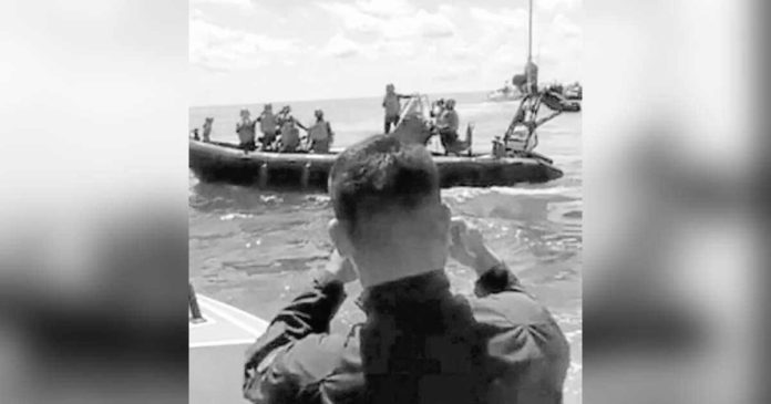 In this screen grab from a Philippine Coast Guard video, members of the China Coast Guard are seen trying to block the medical evacuation of a sick Philippine Navy sailor from the BRP Sierra Madre before the Filipinos outmaneuvered them during an encounter near Ayungin Shoal on May 19. AFP