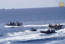 This handout photo taken on May 19, 2024 and received on June 4, 2024 from the Armed Forces of the Philippines shows two Chinese rigid-hulled inflatable boats (left and right) maneuvering close to Philippine personnel on board their boats (second from left and 2nd fron right) near the Philippine outpost at Second Second Thomas Shoal in disputed waters of the South China Sea. PHOTO BY HANDOUT / ARMED FORCES OF THE PHILIPPINES / AFP