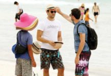 A foreigner tries on hat in Boracay Island in Malay, Aklan in this undated photo. BMI sees tourist arrivals in the Philippines to surpass the pre-pandemic level by 2025. PNA FILE PHOTO