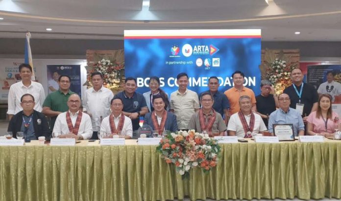 COMMENDATION. Officials of the Municipality of Pavia, Iloilo led by Mayor Laurence Anthony Gorriceta, Vice Mayor Edsel Gerochi and members of the Sangguniang Bayan gather with officials of the Anti-Red Tape Authority at the awarding ceremony yesterday in Pavia, Iloilo. Pavia was bestowed a Certificate of Commendation for being the first local government unit in Panay Island to have an operational Electronic – Business One-Stop Shop. PN PHOTO