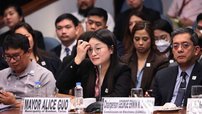 The Department of Interior and Local Government previously said the taskforce created to investigate Mayor Alice Guo’s (center) alleged link to illegal Philippine Offshore Gaming Operations in Bamban, Tarlac had some “troubling findings of serious illegal acts which may have severe legal implications.” MARIANNE BERMUDEZ, PHILIPPINE DAILY INQUIRER