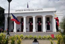 Philippine flags adorn the old Antique capitol building in celebration of the 126th Independence Day on Wednesday, June 12, 2024. PNA PHOTO BY ANNABEL CONSUELO J. PETINGLAY