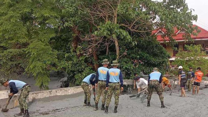 Officers of the La Castellana Municipal Police Station and augmentation personnel from Negros Occidental Police Provincial Office helped in the road clearing operation after a mudflow, triggered by the Kanlaon Volcano eruption, hit Barangay Biak na Bato, La Castellana. PRO-6 PHOTO