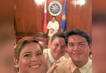 The Duterte siblings, Sara, Paolo, and Sebastian, take a selfie with their father in the background during President Rodrigo Duterte’s oath-taking on June 30, 2016. PHILIPPINE DAILY INQUIRER PHOTO