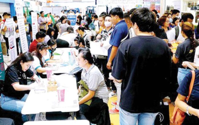 Job applicants queue up in one of the 34 participating companies and government agencies during a job fair at a mall in Marikina City on Labor Day on May 1, 2024. Philippine Statistics Authority data showed that the country's unemployment rate was at 4.0 percent in April this year, down from the recorded 4.5 percent in April 2023. PNA PHOTO BY BEN BRIONES