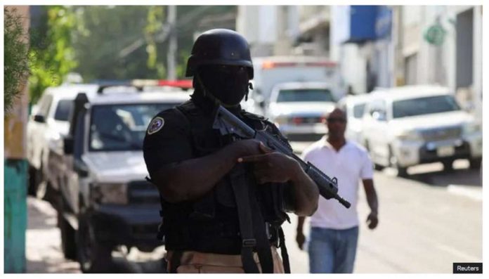 A police officer stands guard in Haiti’s capital Port-Au-Prince. REUTERS