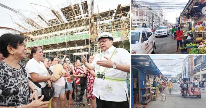 Market vendors interacted with Mayor Jerry P. Treñas during the latter's inspection of the ongoing construction of the Iloilo Central Market. They eagerly shared their anticipation for the market's completion as it would provide them with a cleaner and more suitable space to conduct their businesses. The vendors are currently operating at temporary stalls along city streets while awaiting the newly redeveloped market's opening.
