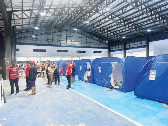 Displaced residents are currently taking temporary shelter in this evacuation center prepared by the La Carlota City Government in Negros Occidental. JUDGE MAVIL MAJARUCON-SIA PHOTO