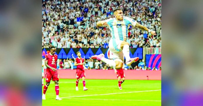 Argentina’s Lautaro Martínez jumps in the air after scoring a goal against Canada. PHOTO COURTESY OF AFA-SELECCÍON ARGENTINA