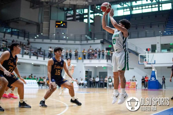 De La Salle University Green Archers’ Jacob Cortez pulls up for a shot against two National University Bulldogs defenders. PHOTO COURTESY OF DIEGO ROA/DLSU SPORTS