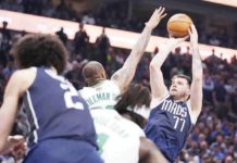 Dallas Mavericks’ Luka Doncic shoots over the defense of Boston Celtics’ Xavier Tillman Sr. AP