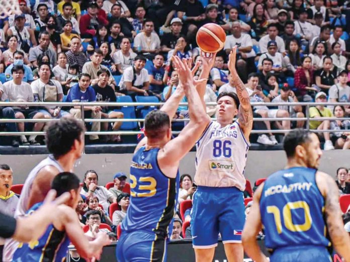 Gilas Pilipinas’ Dwight Ramos pulls up for a shot against the defense of Taiwan Mustangs’ Sam Deguara. PHOTO COURTESY OF PILIPINAS LIVE