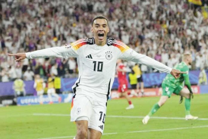 Germany’s Jamal Musiala celebrates after scoring his side’s second goal during a round of 16 match between Germany and Denmark. AP PHOTO/ANDREEA ALEXANDRU