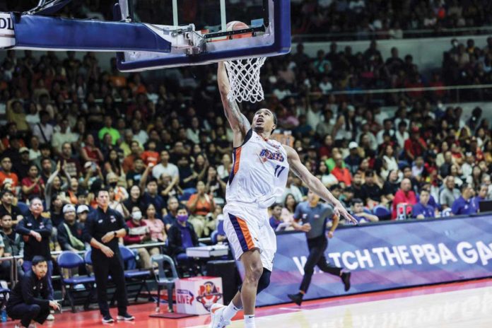 Meralco Bolts’ Chris Newsome soars for a fastbreak dunk. PBA PHOTO