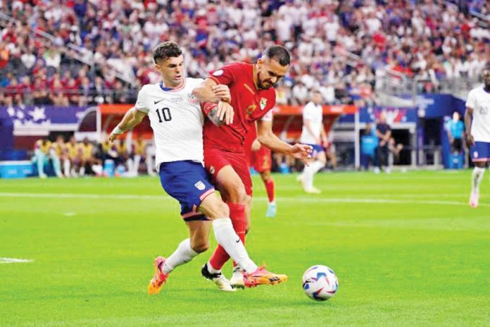 Bolivia’s defender Luis Haquin (No. 4) and United States forward Christian Pulisic (No. 10) chase the ball during their Copa America game on Sunday. PHOTO COURTESY OF USA TODAY SPORTS