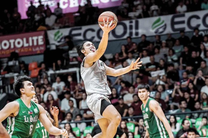 University of the Philippines Fighting Maroons’ JD Cagulangan sticks his tongue out as he goes for a layup. FILOIL SPORTS PHOTO