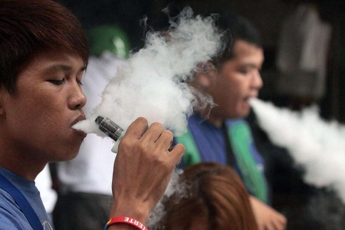 Vape users puff away at a store in Sta. Cruz, Manila in this file photo. DANNY PATA PHOTO