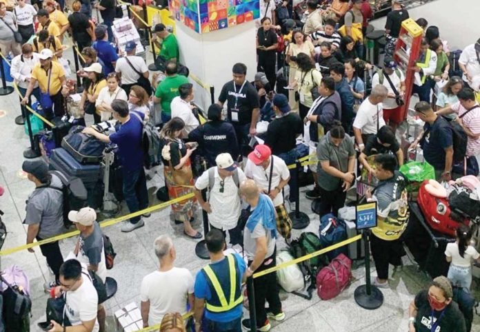 A total of 2,951 passengers were stranded at the Bacolod-Silay Airport in Negros Occidental and Iloilo Airport in Iloilo Province on Tuesday morning, June 4, following the eruption of Kanlaon Volcano. Photo shows the stranded passengers at the Iloilo Airport in Cabatuan town. CAAP ILOILO PHOTO