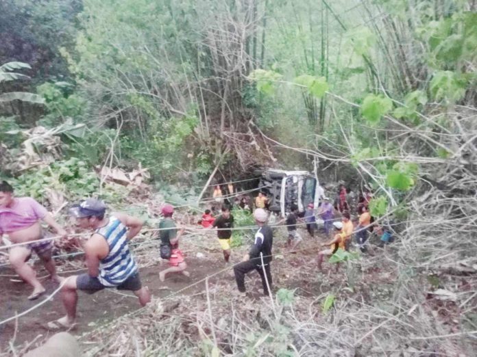 Police, Bureau of Fire Protection and municipal disaster risk reduction and management office personnel joined forces in the rescue operation after a van carrying 16 people fell into a ravine in Barangay Maliao, Leon, Iloilo on Monday afternoon, June 3. MARVIN CANIEDO PHOTO