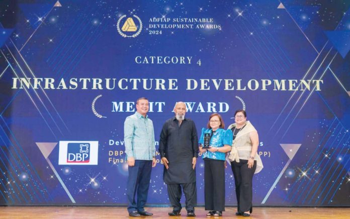 Development Bank of the Philippines (DBP) Senior Vice President Carolyn Olfindo (third from left) and DBP Vice President Raquel Atienza (rightmost) receive the Association of Development Financing Institutions in Asia and the Pacific (ADFIAP) Merit Award for Infrastructure Development from ADFIAP 2nd Vice Chairman Kao Thach (leftmost) and Chairman Saud Minam (2nd from left) during the ADFIAP Sustainable Awards held in Phnom Penh, Cambodia.