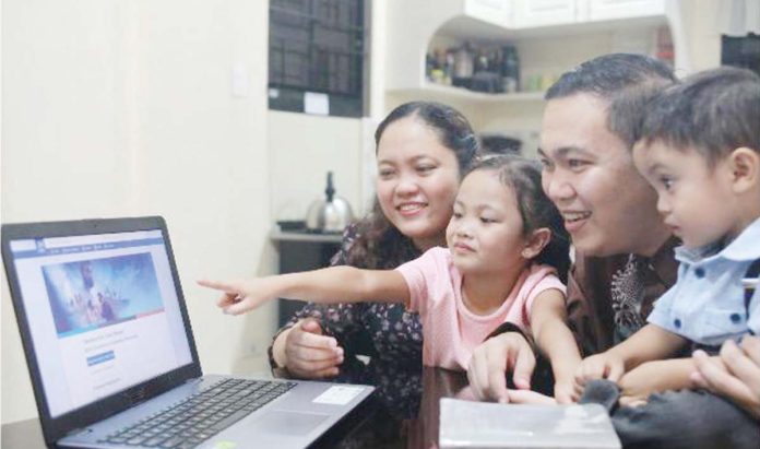 The Crispo family watches a preview of the featured drama in the “Declare the Good News” Convention.