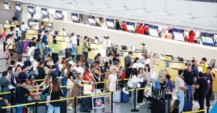 Eight airlines at the Ninoy Aquino International Airport Terminal (NAIA) 3 and one in Terminal 2 were affected by the global outage of information technology systems on Friday, July 19. Photo shows passengers at the NAIA Terminal 3 on Friday. NAIA/FACEBOOK PHOTO