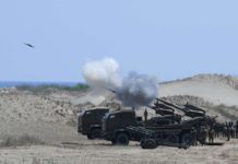 Philippine Army personnel fire their Autonomous Truck Mounted howitzer system (ATMOS), a 155 mm caliber self-propelled gun system, during the maritime strike exercise as part of the joint US-Philippines annual military Balikatan drills on a strip of sand dunes in Laoag on Luzon island’s northwest coast on May 8, 2024. FILE PHOTO/AGENCE FRANCE-PRESSE