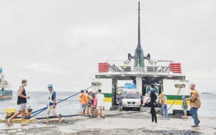 Maritime transportation is costlier in the Philippines than in neighboring countries in Southeast Asia, with destination charges playing a larger role. Photo shows passengers and cargoes loading a ferry in the port of Allen, Northern Samar. PHOTO COURTESY OF ARIES MATALAM