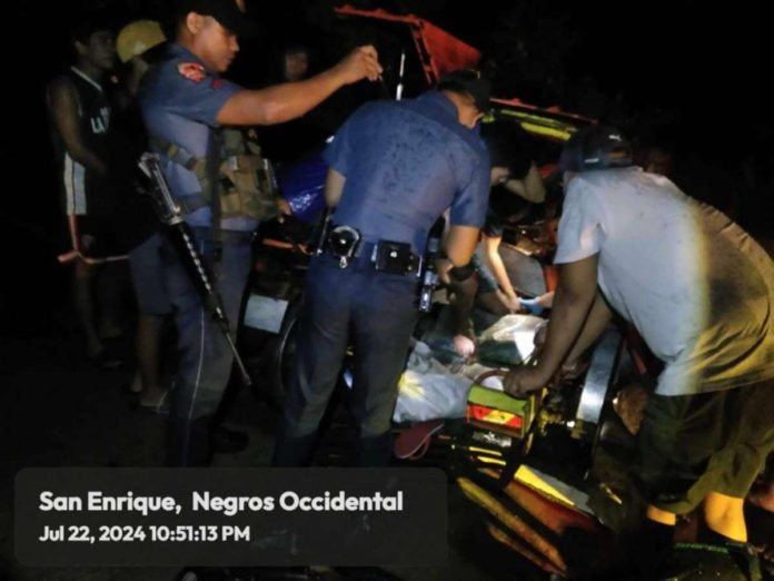 Officers of the San Enrique Municipal Police Station and residents rescued a minor who was stuck inside a tricycle after it collided with a motorcycle on Sunday night, July 21. K5 NEWS FM HINIGARAN/FACEBOOK PHOTO