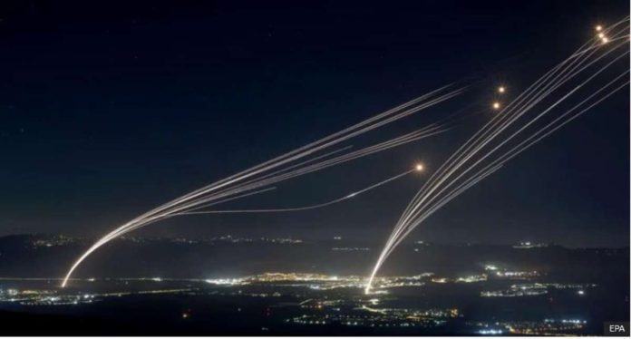 Projectiles fired from the Israeli Iron Dome air defense system intercept missiles fired from southern Lebanon, over the upper Galilee, northern Israel, early on August 4, 2024. EPA