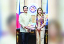 Budget Secretary Amenah Pangandaman (right) thanks President Ferdinand “Bongbong” R. Marcos Jr. (left) for signing Executive Order No. 64, which the Department of Budget and Management needs to implement the Salary Standardization Law VI.