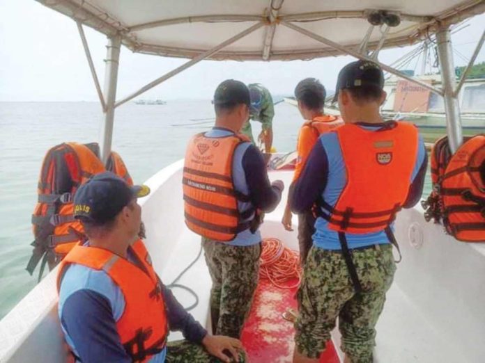 Personnel of the Philippine Coast Guard in Romblon assisted in the search and rescue efforts for the nine remaining passengers who went missing after a motorbanca capsized off Caluya, Antique on Monday, August 26. PHOTO COURTESY OF JOURNAL PH