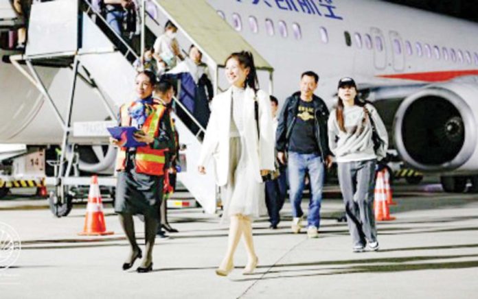 Chinese tourists alight from the plane upon arrival in Kalibo, Aklan in this photo taken in April 2023. PHOTO COURTESY OF DOT