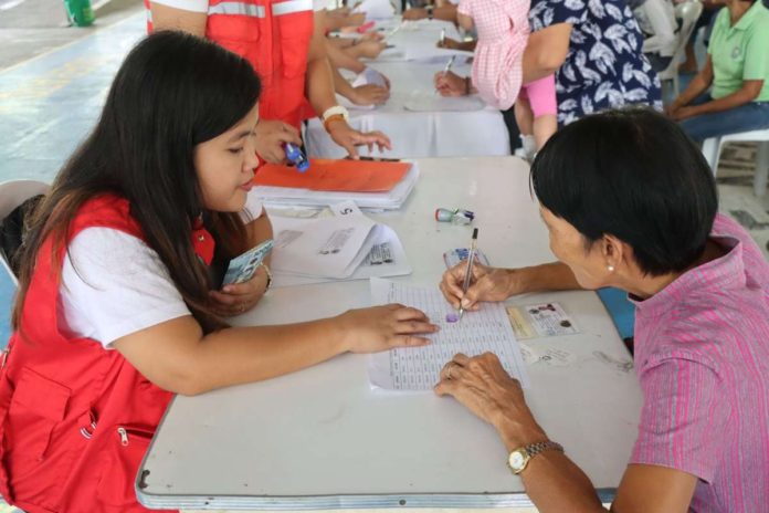 A senior citizens completes some paperwork before receiving her government social pension. The Social Pension Program aims to fulfill the government’s commitment to protect vulnerable seniors by providing a stipend of P1,000 per month to indigent citizens aged 60 and above who are frail, sick, disabled, without a pension, permanent income, or financial assistance from relatives. DSWD-6 PHOTO