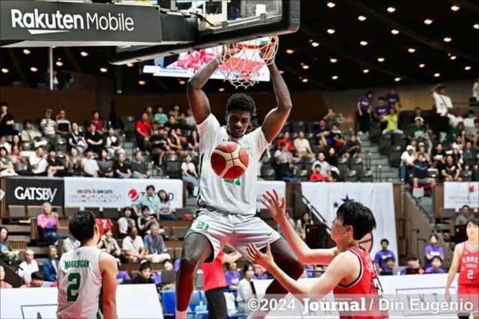 De La Salle University Green Archers’ Henry Agunnane scores on a two-handed dunk. PHOTO COURTESY OF DIN EUGENIO/FJJOURNAL