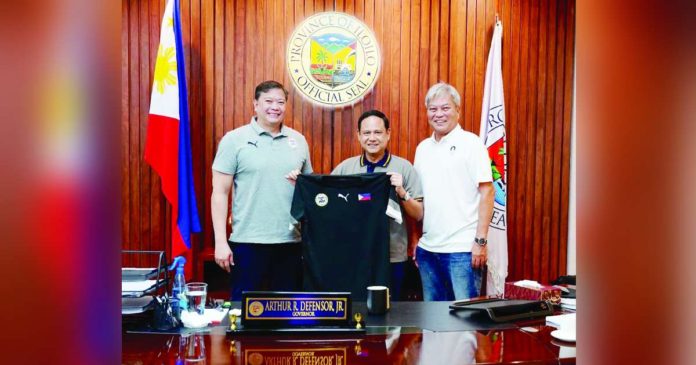 Iloilo’s Gov. Arthur Defensor Jr. (center) receives a PFF jersey from PFF President John Anthony Gutierrez (left) and former PFF President Nonong Araneta (right). CONTRIBUTED PHOTO