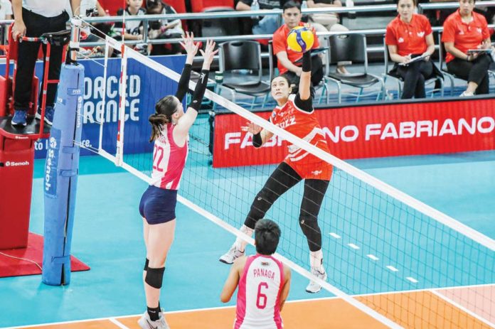 Ilongga Aiza Maizo-Pontillas of Petro Gazz Angels attempts to score against Creamline Cool Smashers’ Erica Staunton. PVL PHOTO