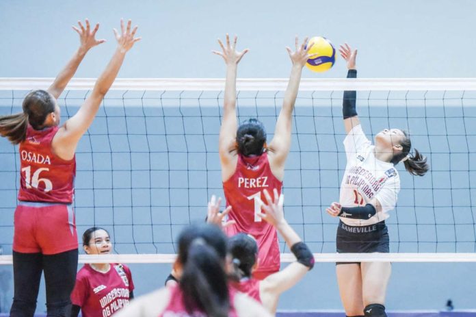 Negrense Jothea Ramos of the University of the Philippines Fighting Maroons scores against a Lyceum of the Philippines Lady Pirates' defender. V-LEAGUE PHOTO