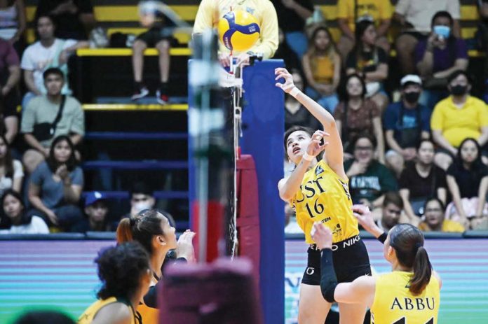 Negrense Cassie Carballo of University of Santo Tomas Golden Tigresses drops the ball towards the side of Far Eastern University Lady Tamaraws. V-LEAGUE PHOTO